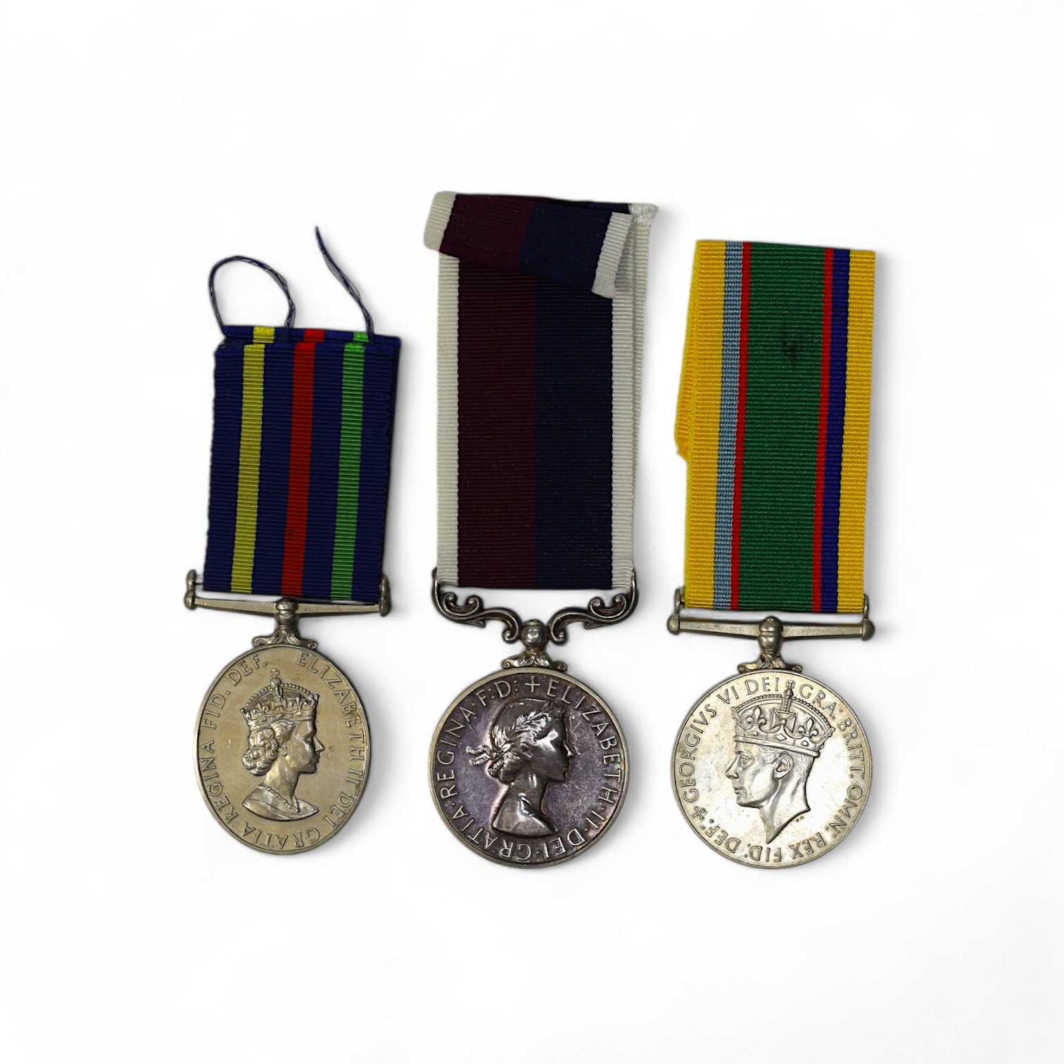 Three assorted service medals; GVI Cadet Forces medal to ACT. FG. Off. A. Liddell R.A.F.V.R (T); ERII Civil Defence Long Service medal unnamed; ERII RAFLSGC to E2418184 Cpl G R B Lowe RAF. Condition - fair to good.